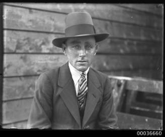 Image of a man, possibly apprentice E J Martin, standing near Phar Lap's accomodation SS MONOWAI