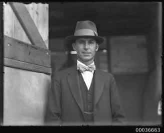 Image of a man, possibly vet W. Neilson, standing near Phar Lap's accomodation SS MONOWAI