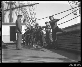 Youthful crew working ropes aboard C B PEDERSON.