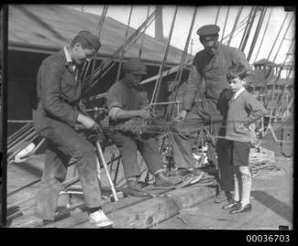 Group of three adults one child on deck of C.B. PEDERSON.