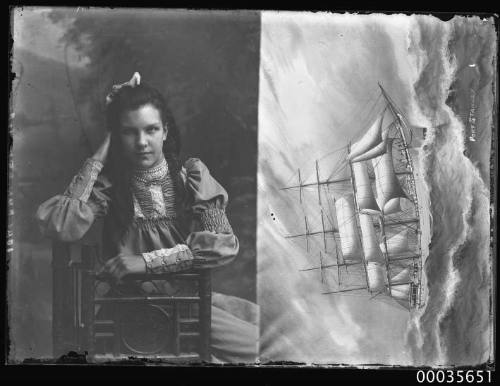 Ship PORT STANLEY: Girl seated on a chair