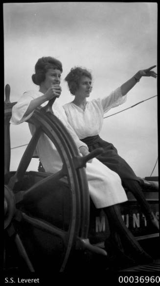 MOUNT STEWART - two women posed with the ship's wheel