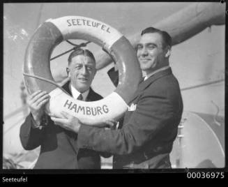 Count Felix Graf von Luckner and an unidentified man holding a lifebuoy on SEETEUFEL