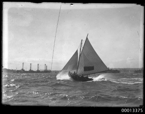 18'footer AUSTRALIA  flying on Sydney Harbour.