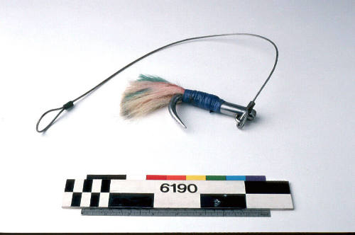 METAL HOOK, PINK SYNTHETIC FIBRES AND BLUE FEATHERS ATTACHED TO SHAFT WITH BLUE PLASTIC TAPE, LENGTH OF METAL CABEL ATTACHED TO HOOK