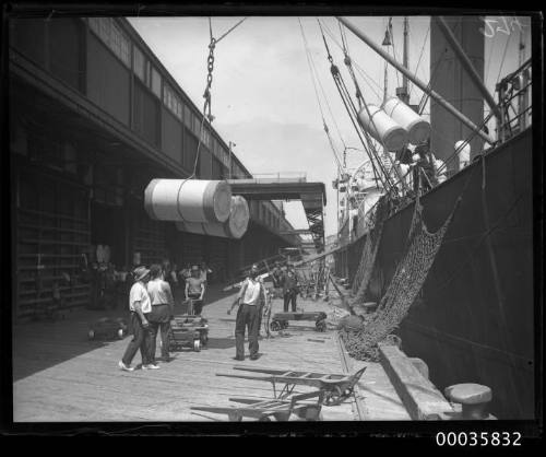 Unknown vessel unloading cargo at Jones Bay wharf