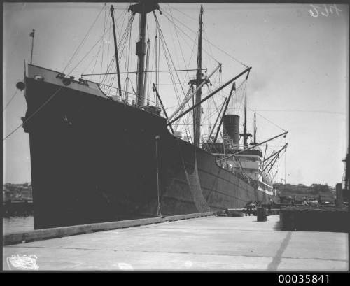 MOSEL unloading oil drums at Johnstons Bay, Sydney, New South Wales.