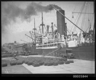 MOSEL unloading oil drums at Johnstons Bay, Sydney, NSw.