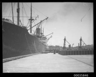 MOSEL unloading oil drums at Johnstons Bay, Pyrmont, Sydney.