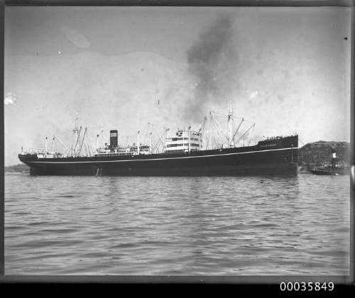 View of TALLEY RAND under tow in harbour.