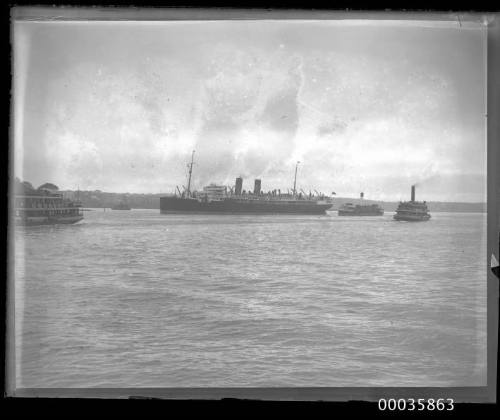 View of passenger liner with two funnels underway in Sydney Harbour, Sydney, New South Wales.