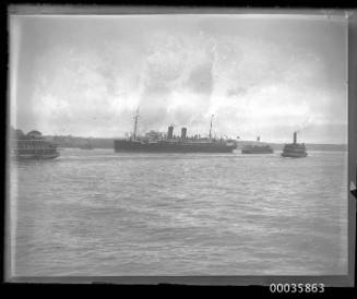 View of passenger liner with two funnels underway in Sydney Harbour, Sydney, New South Wales.