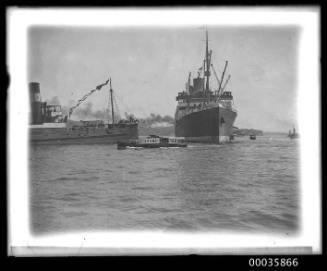 View of unidentified passenger / cargo ship in harbour.