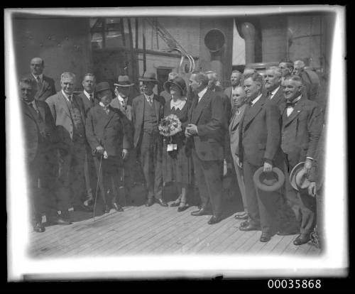 View of passengers or dignatories on deck of unidentified ship.