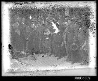 View of passengers or dignatories on deck of unidentified ship.