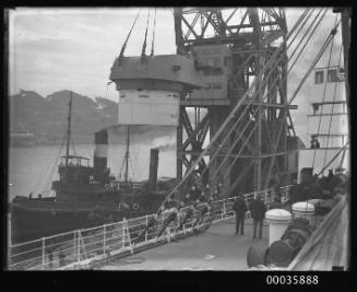 Titan crane loading gun turret to steamer.