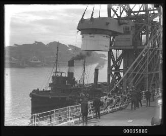 Titan crane loading gun turret to steamer.