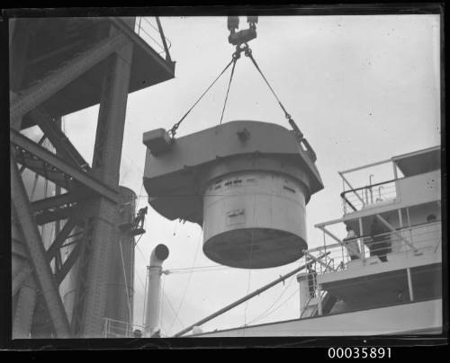 Titan crane loading gun turret to steamer.