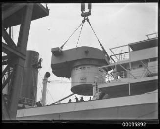 Titan crane loading gun turret to steamer.