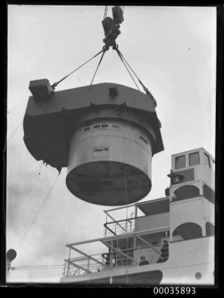 Titan crane loading gun turret to steamer.