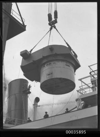 Titan crane loading gun turret to steamer.