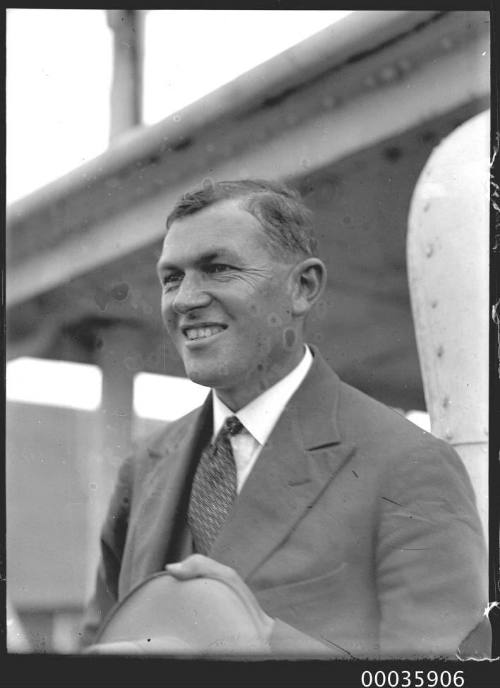 Portrait of male passenger on deck of SS RUNIC possibly at Millers Point, Sydney