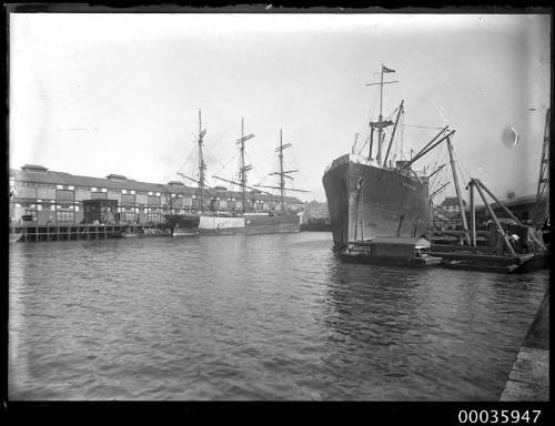 SS CLAN MACARTHUR and a three masted ship, probably the BARGO, at the wharves in Sydney