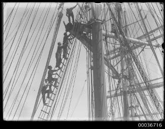 MUSCOOTA view of rigging with work crew on ladders.