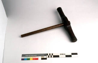 Caulking mallet with a wooden head and handle