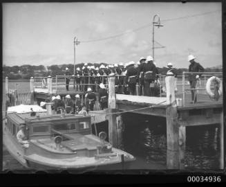 Military marching band waiting on a wharf in farm cove, Sydney, New South Wales.