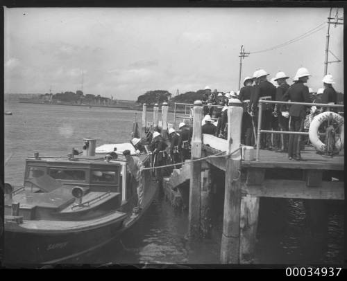 Military marching band waiting on a wharf in farm cove, Sydney, New South Wales.