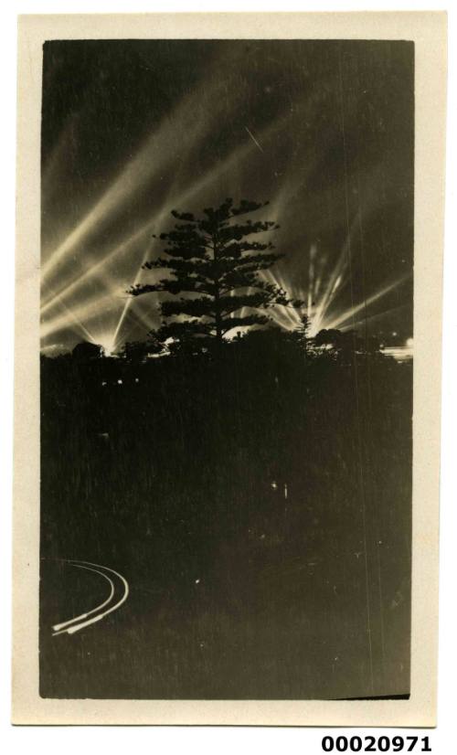 Search lights and trees possibly during the United States Navy visit