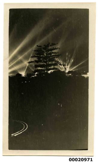 Search lights and trees possibly during the United States Navy visit