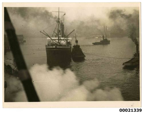 Unidentified merchant vessel with a tug possibly in Pyrmont in Sydney