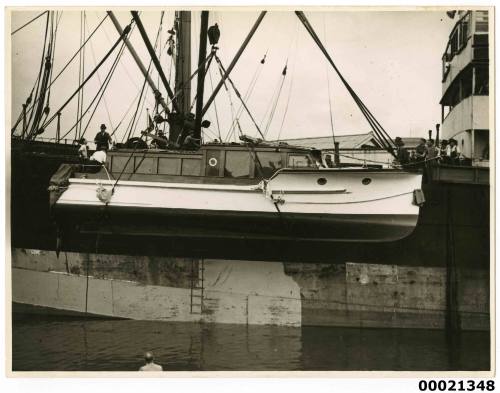 Unidentified motor launch, possibly a Lloyd Wright design transported from Brisbane, being lowered from SS CARLISLE