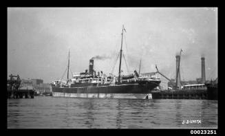 Starboard view of SS UMTA moored at a dock