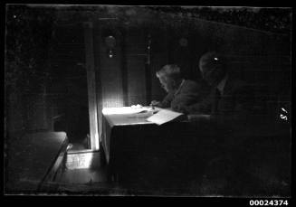 Richard and Harold Nossiter Snr seated inside the dark saloon of SIRIUS