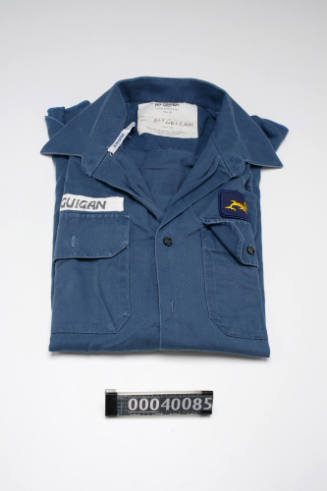 RAN working dress blue long sleeved shirt with a submarine dolphin badge over left breast pocket