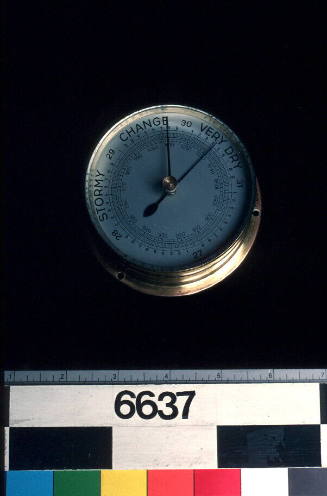 Aneroid barometer in spun brass case