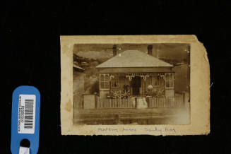 Edward and Elizabeth Moulding standing outside their home in Sandy Bay, Hobart