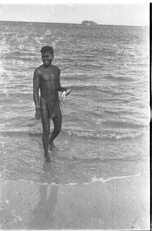 View of a man at the water's edge