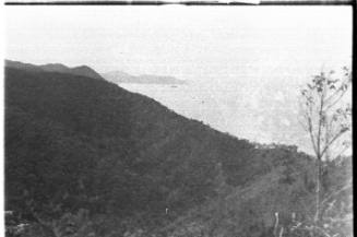 View across a coastline with heavily forested mountains