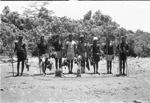 View of men with spears and their catches 