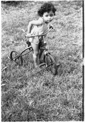 View of a child on a tricycle