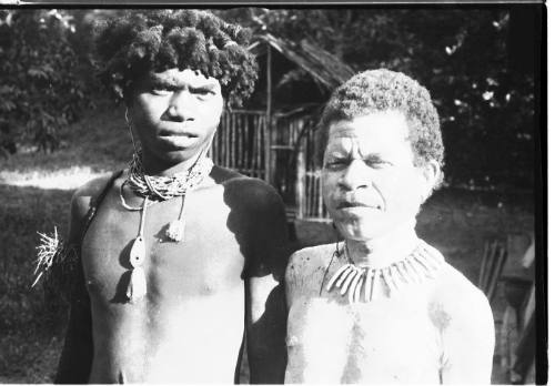 View of two men wearing traditional jewelry 