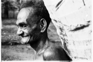 Profile view of a man against a tree 