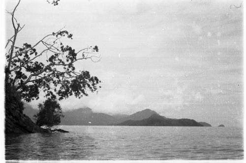 View across water towards mountains