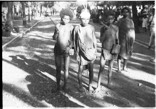 View of men standing on a road