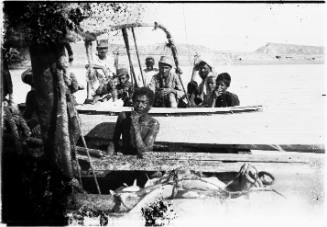 View of people seated in a boat