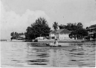 View of a man in a canoe on the water 